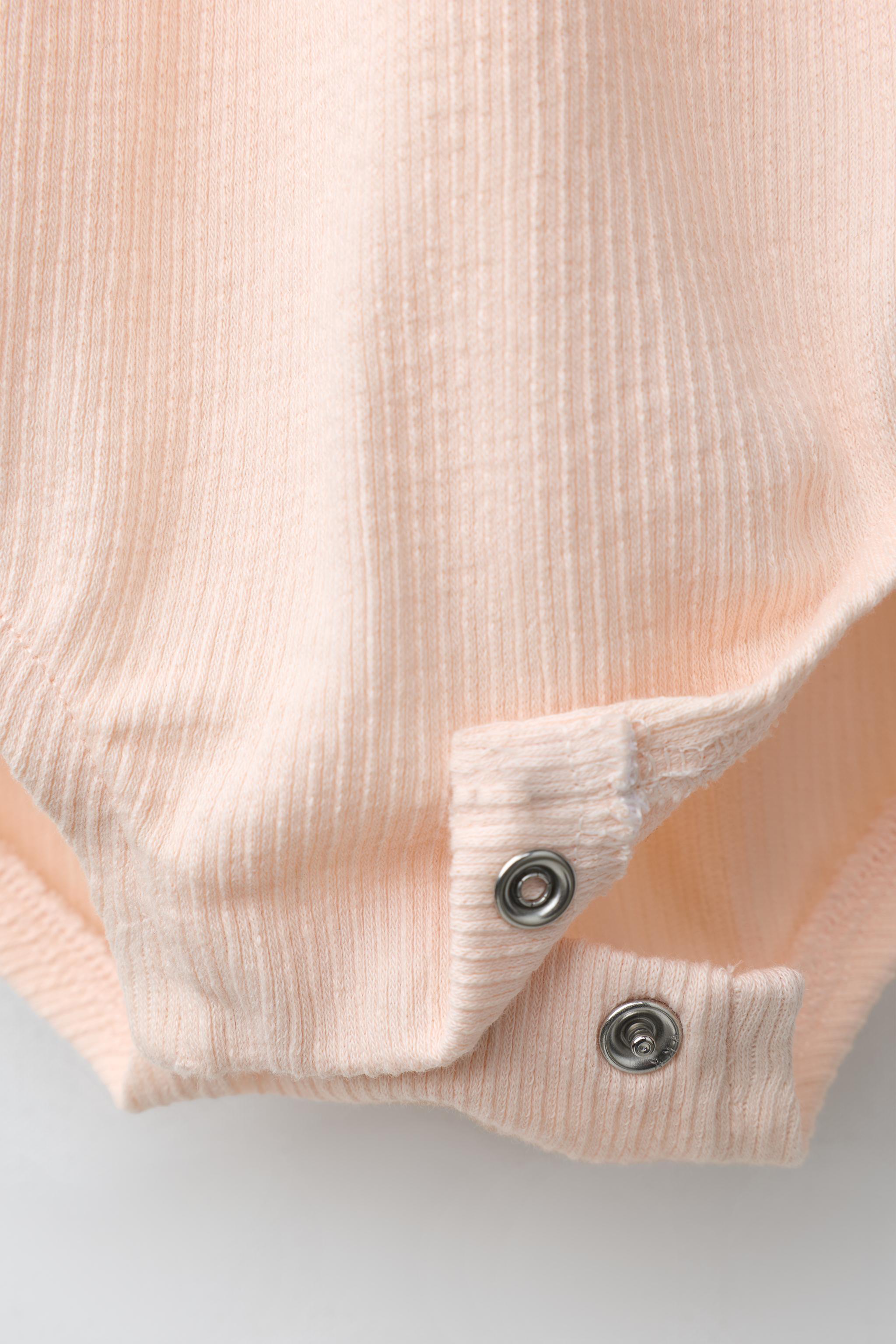 SUN EMBROIDERED RUFFLED BODYSUIT