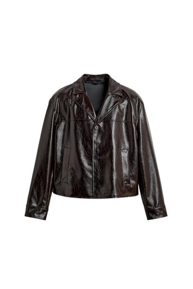 Front view of a dark brown jacket with a glossy finish, lapels, button fastening, and side pockets.