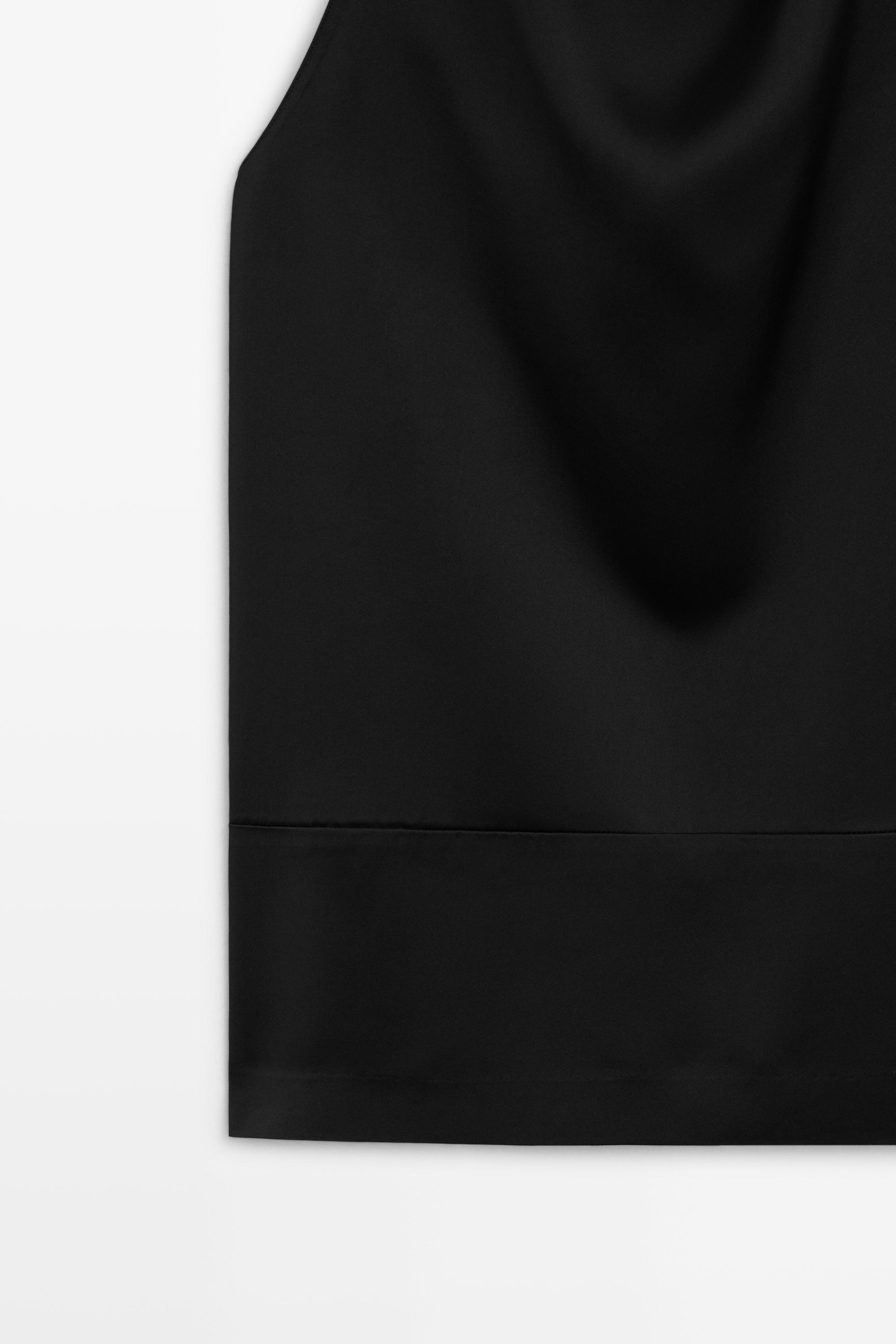 Flowing halter neck top with waistband effect