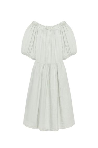 Front view of an aqua green dress with a straight elasticated neckline, three-quarter puff sleeves, and an asymmetrical hem.