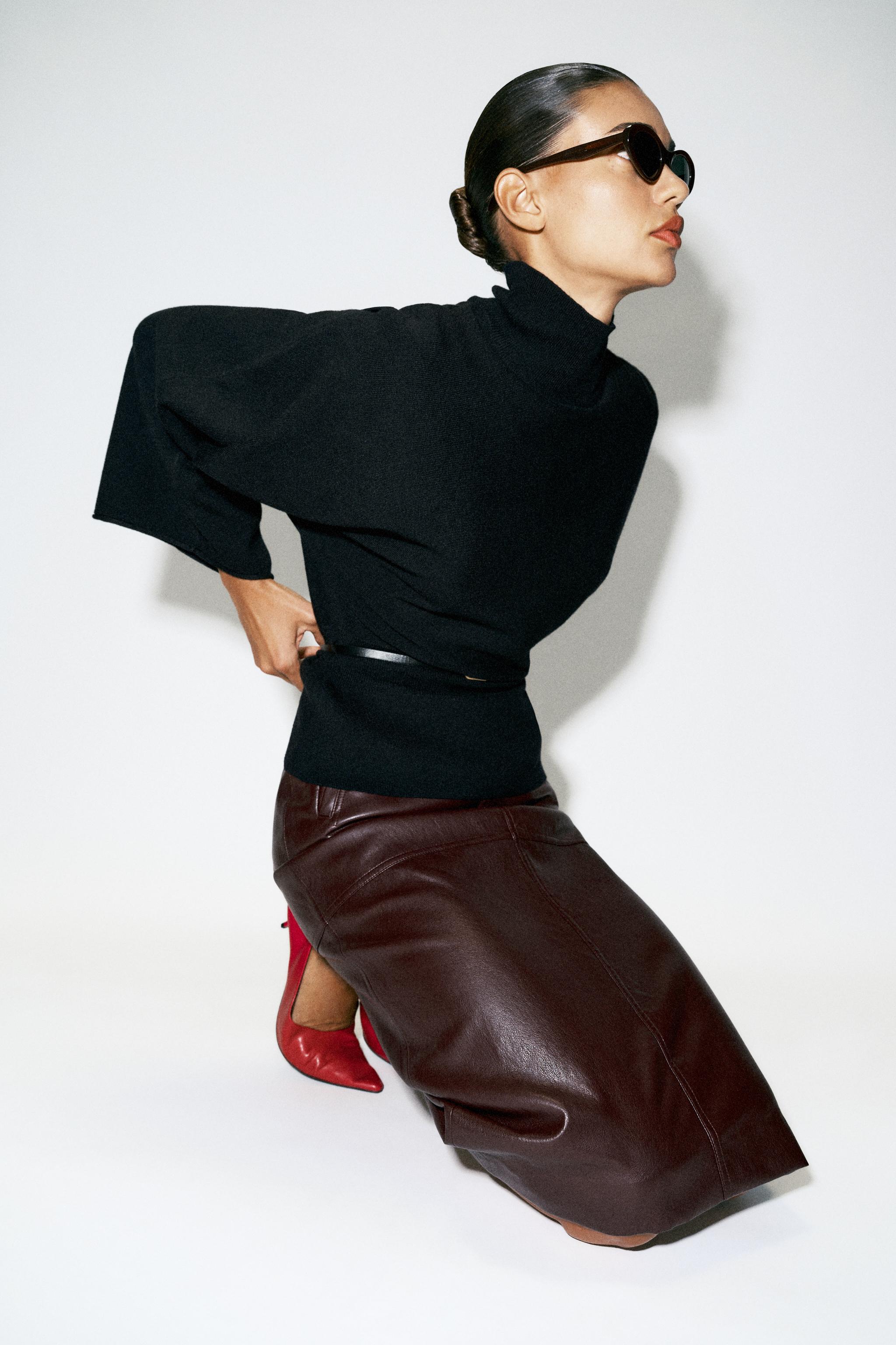 BELTED KNIT SWEATER