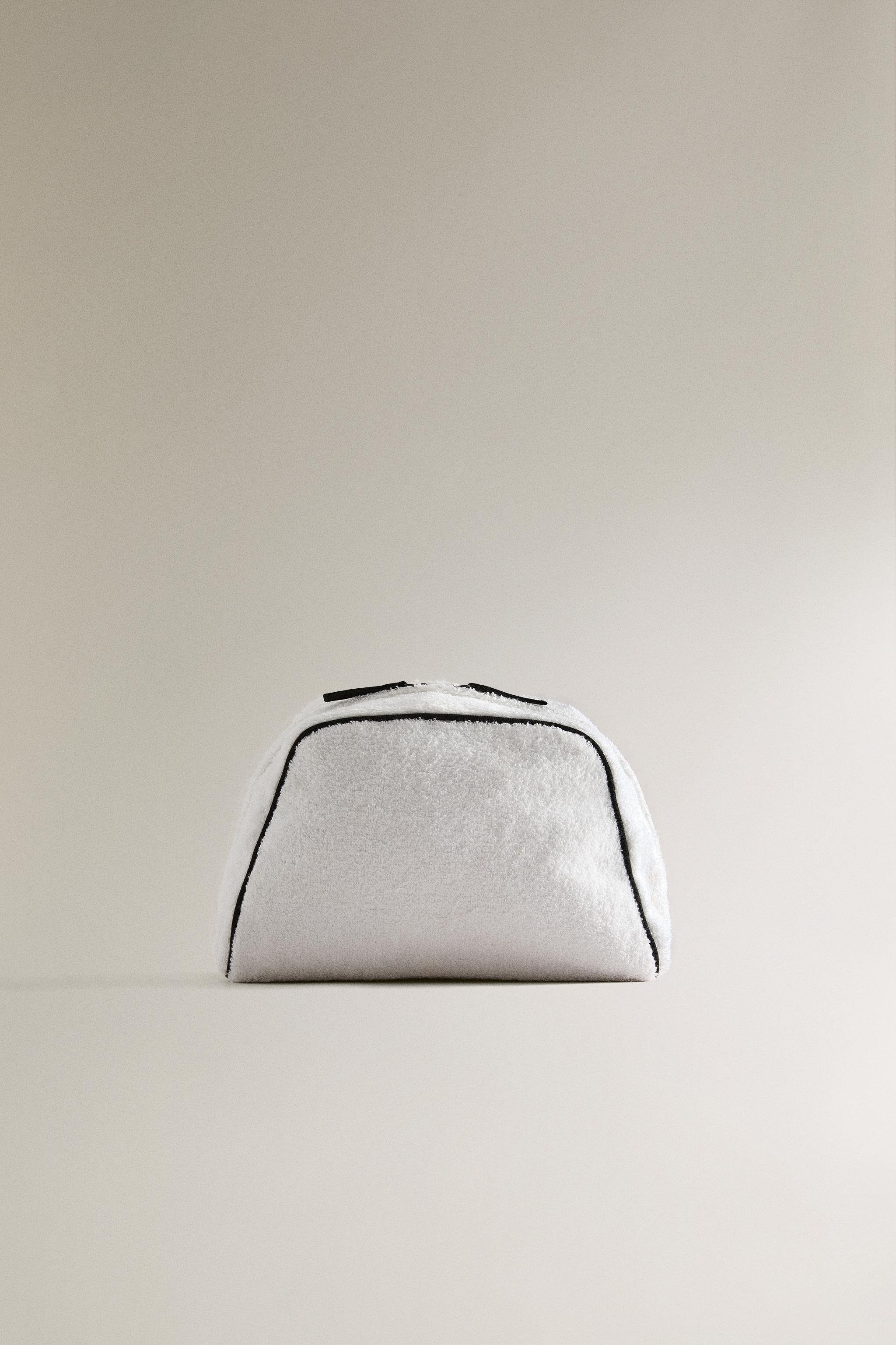 TERRY CLOTH TOILETRY BAG WITH PIPING DETAIL