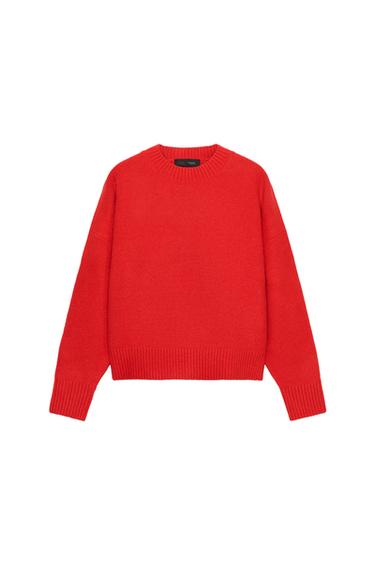 Front view of a plain knit red jumper with a round neck, long sleeves and ribbed trims.