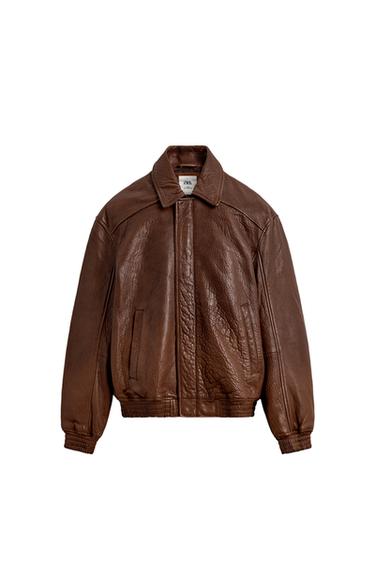 Front view of a cognac-coloured jacket with classic collar, front fastening and side pockets.