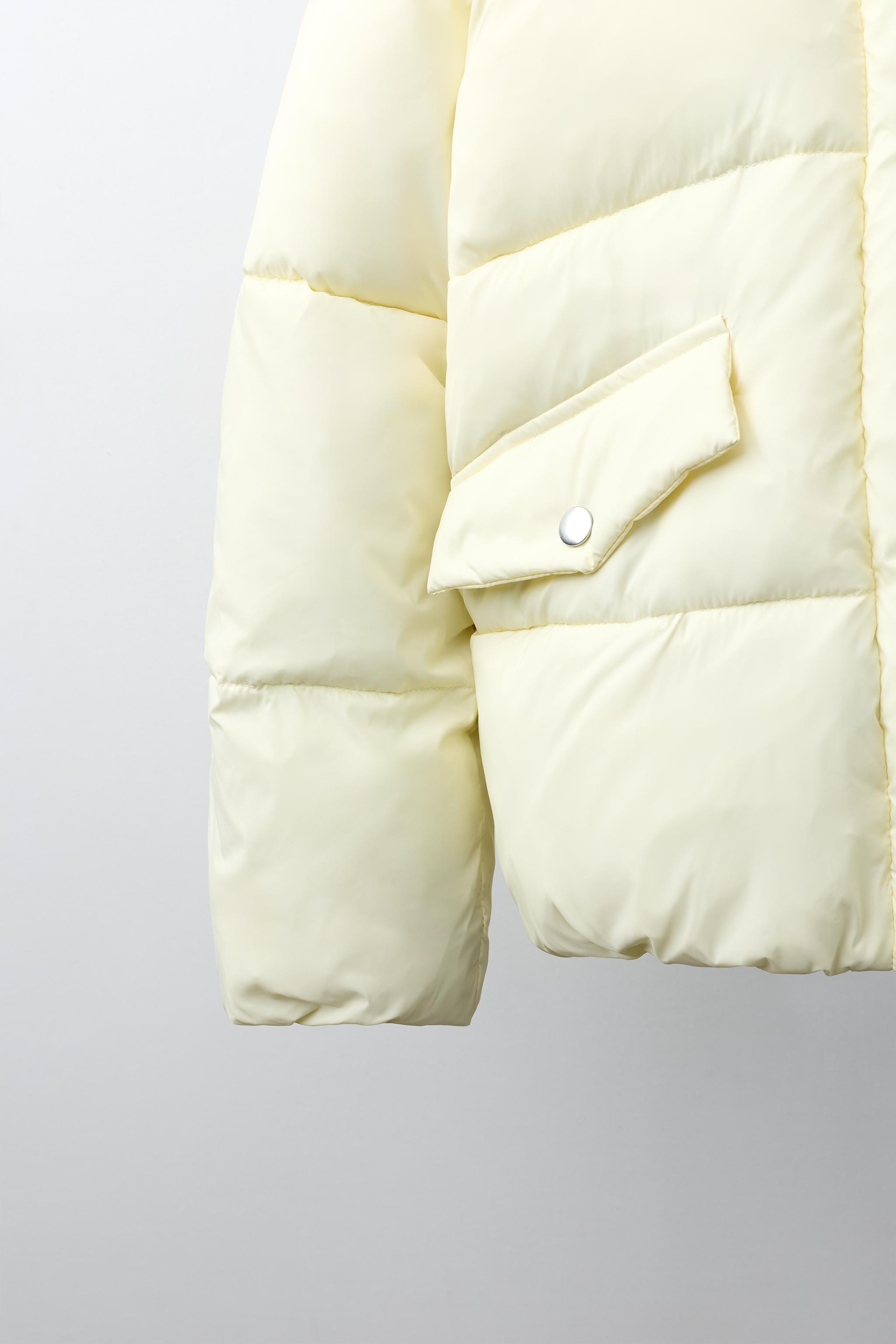 BLOUSON MATELASSÉ À CAPUCHE DÉPERLANT