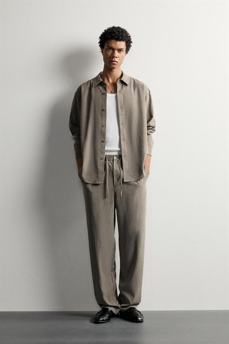 RELAXED FIT FLOWING TROUSERS