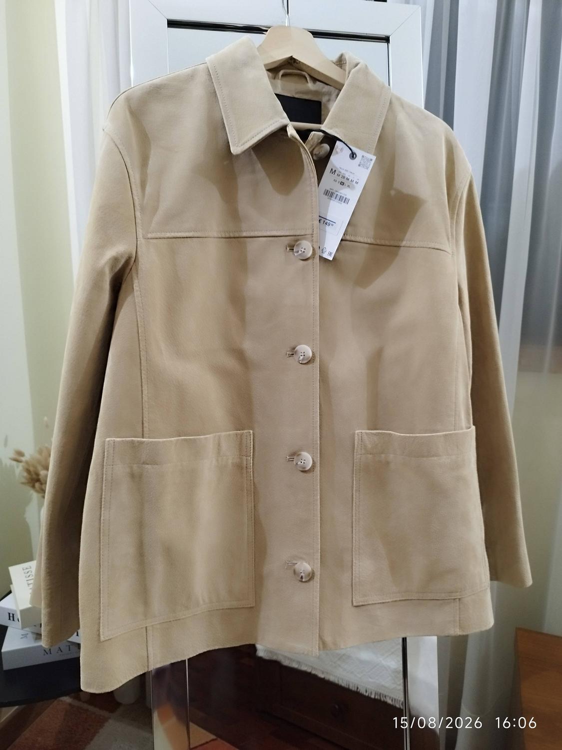 Beige button-up jacket on a hanger. Text: M M 28 M M M, € 149, MATISSE, H, 15/08/2026 16:06.