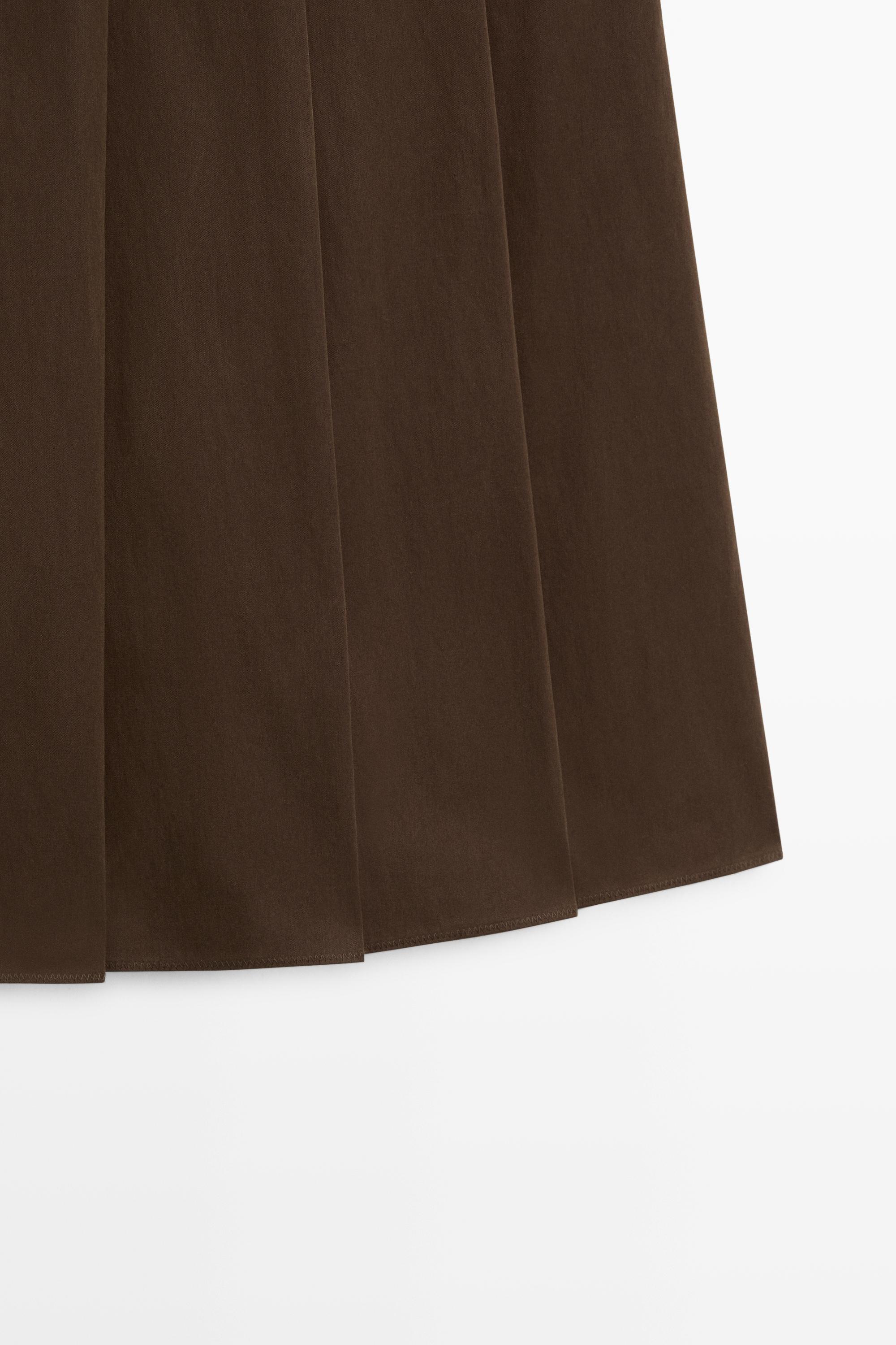 Jupe midi plissée détail cuir