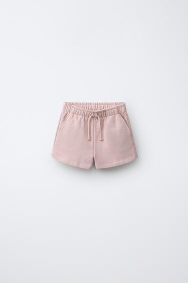 PANTALLONA TË SHKURTRA TË PUSHTA ME STAMPA YJESH - Rozë e zbehtë nga Zara - Imazh 0