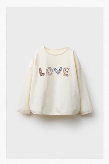 T-SHIRT AVEC INSCRIPTION ET PIÈCES - Écru de Zara