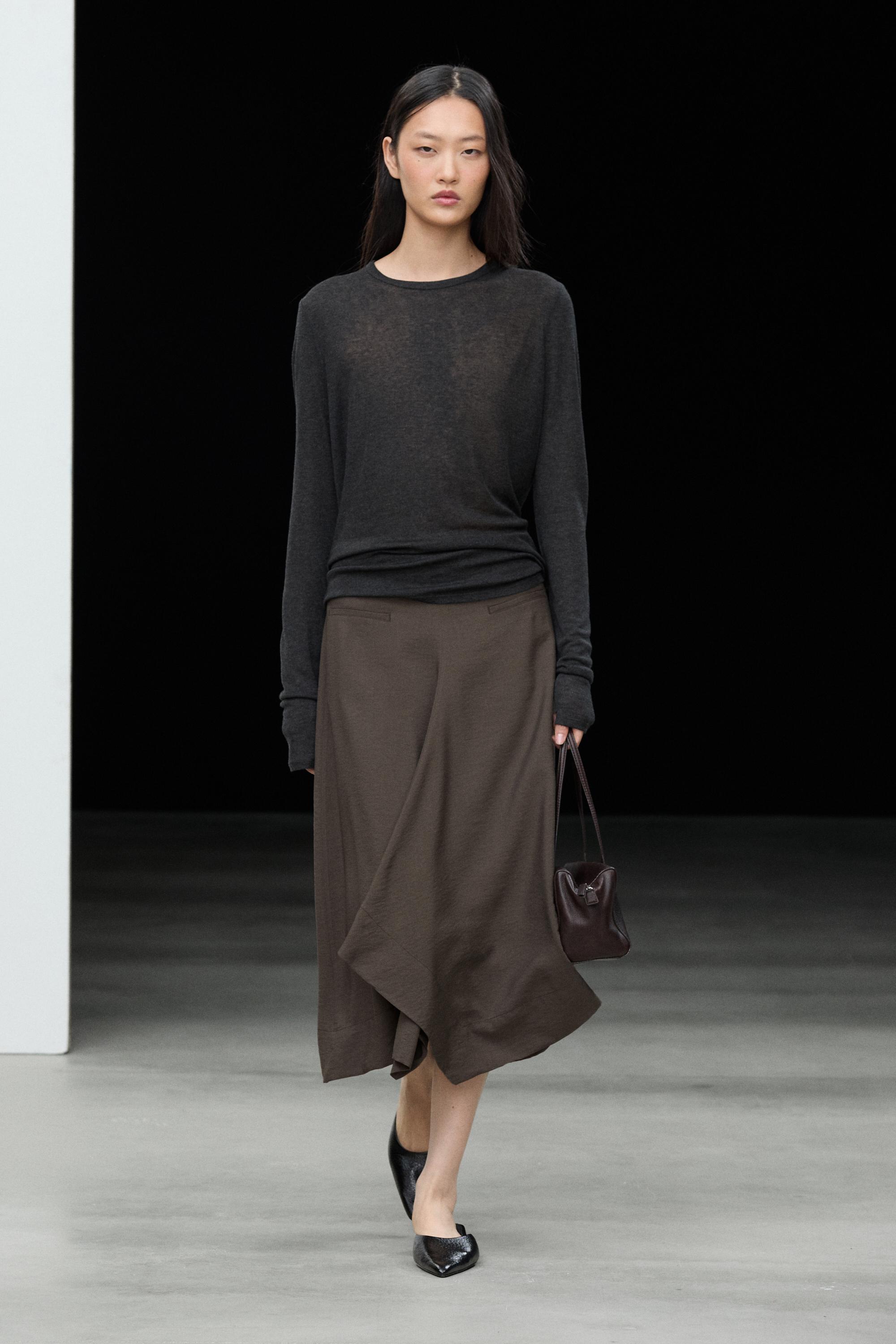 Flowing midi skirt with pleated detail