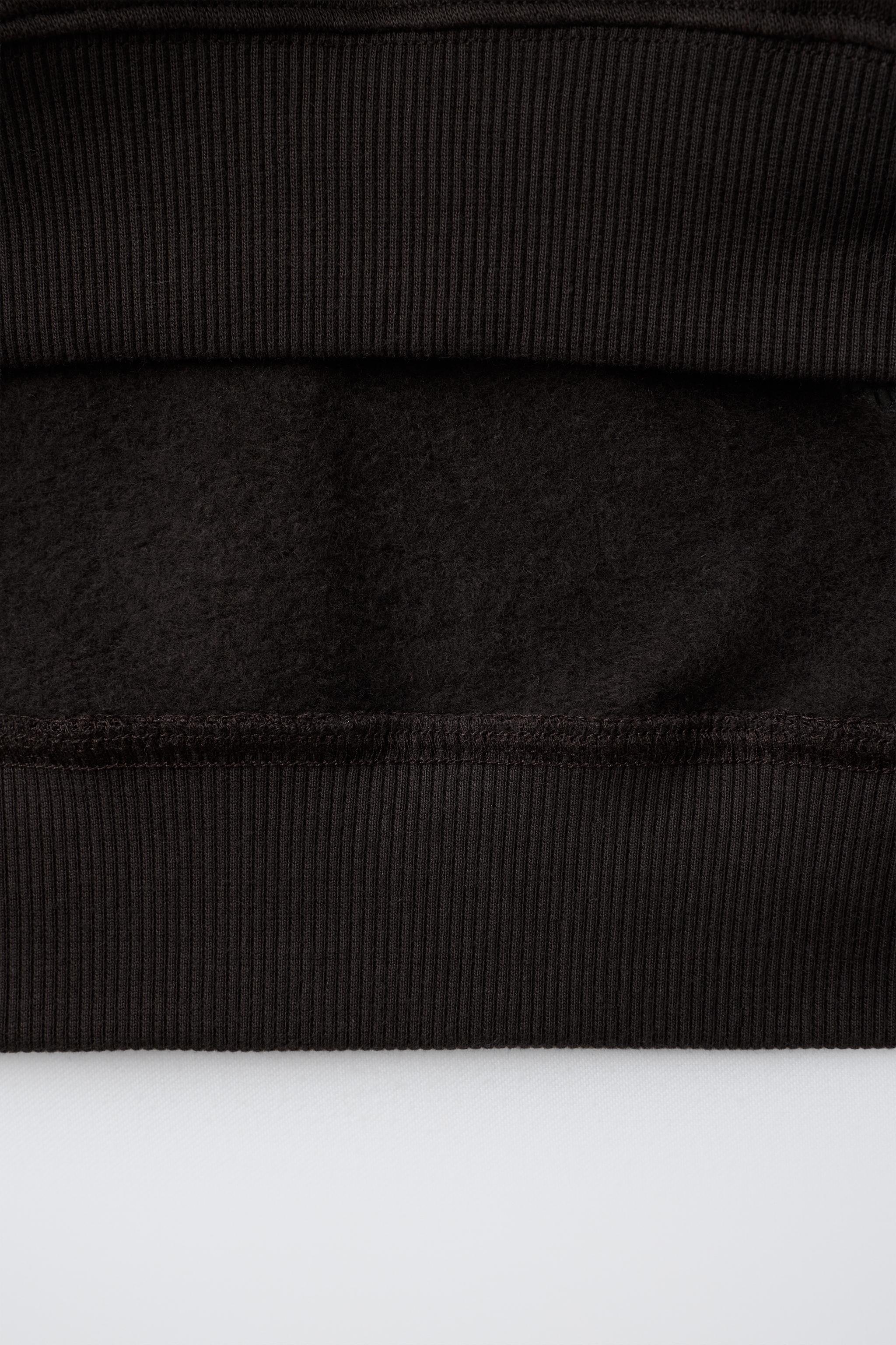 BOW APPLIQUÉ SWEATSHIRT