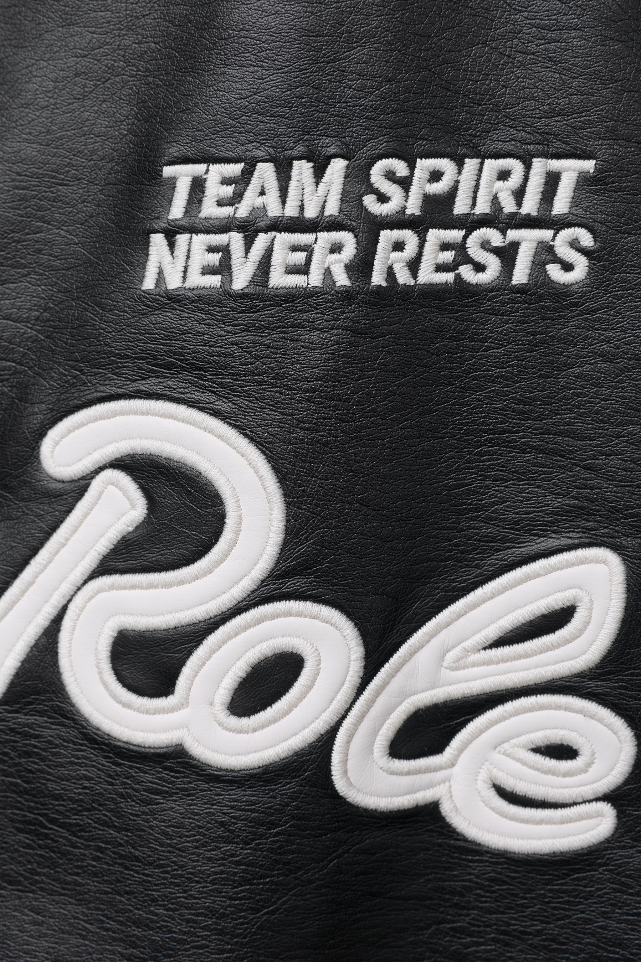 FAUX LEATHER BOMBER JACKET WITH EMBROIDERED TEXT