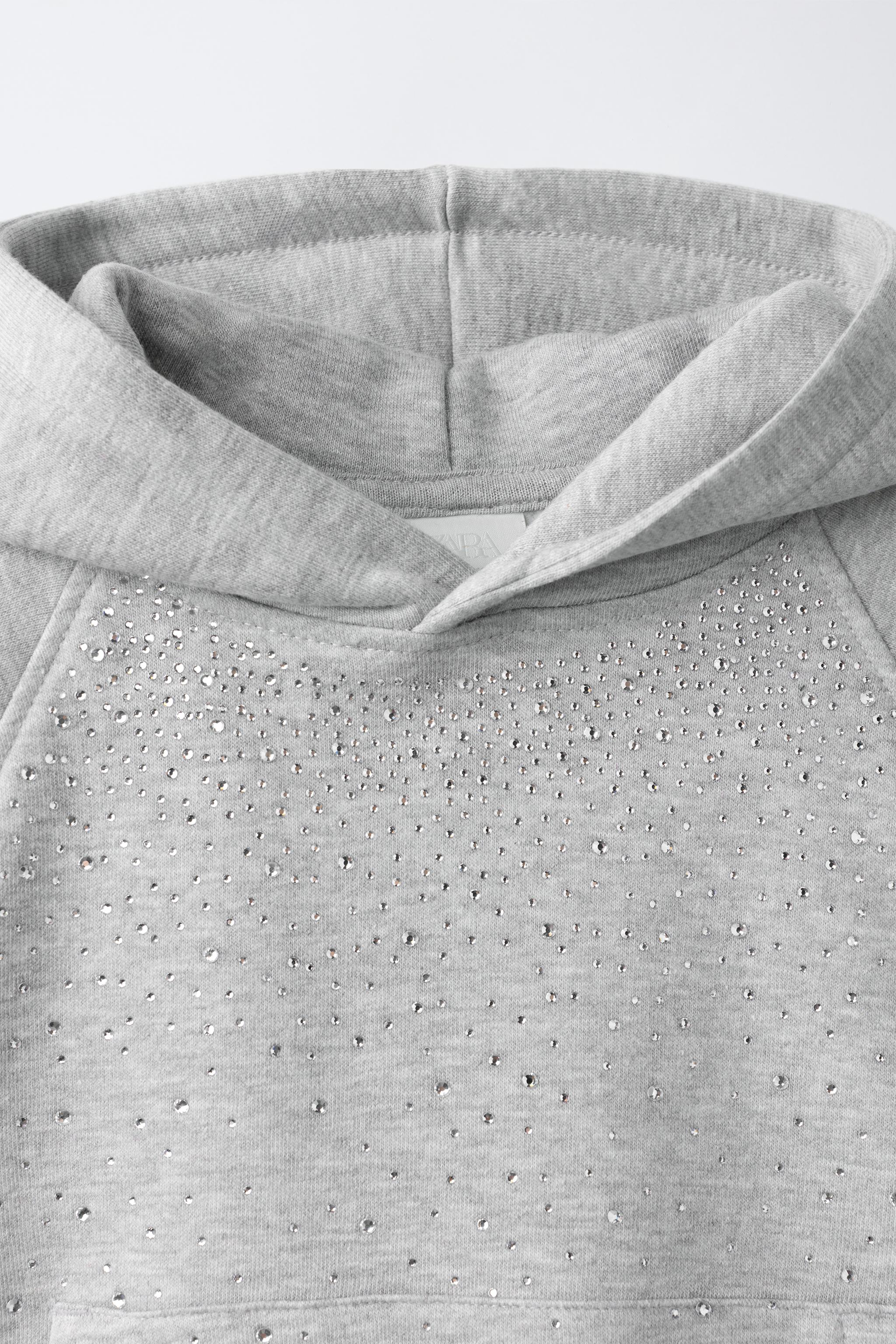 SWEAT À CAPUCHE DÉCOR STRASS
