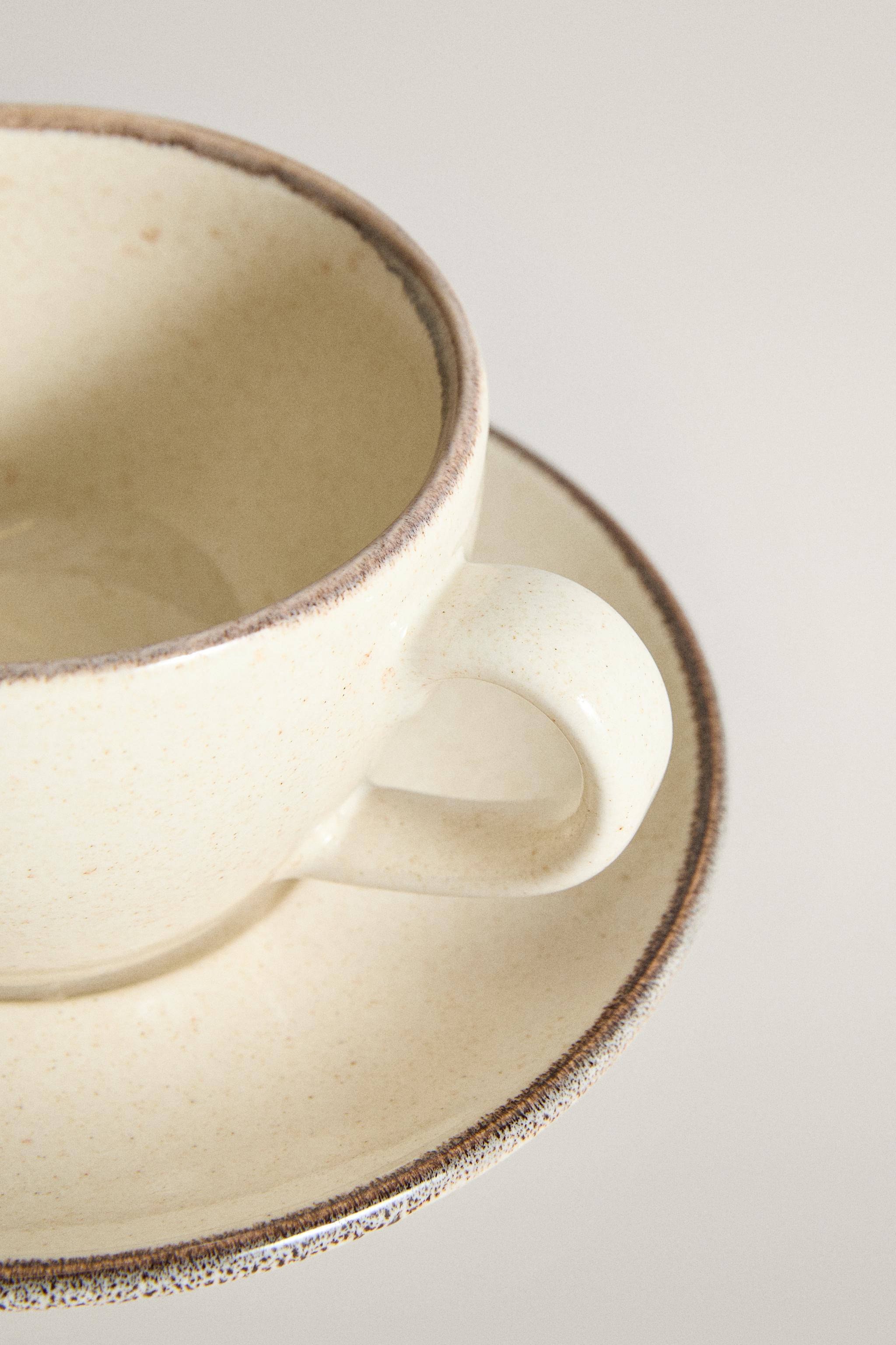 STONEWARE TEACUP AND SAUCER