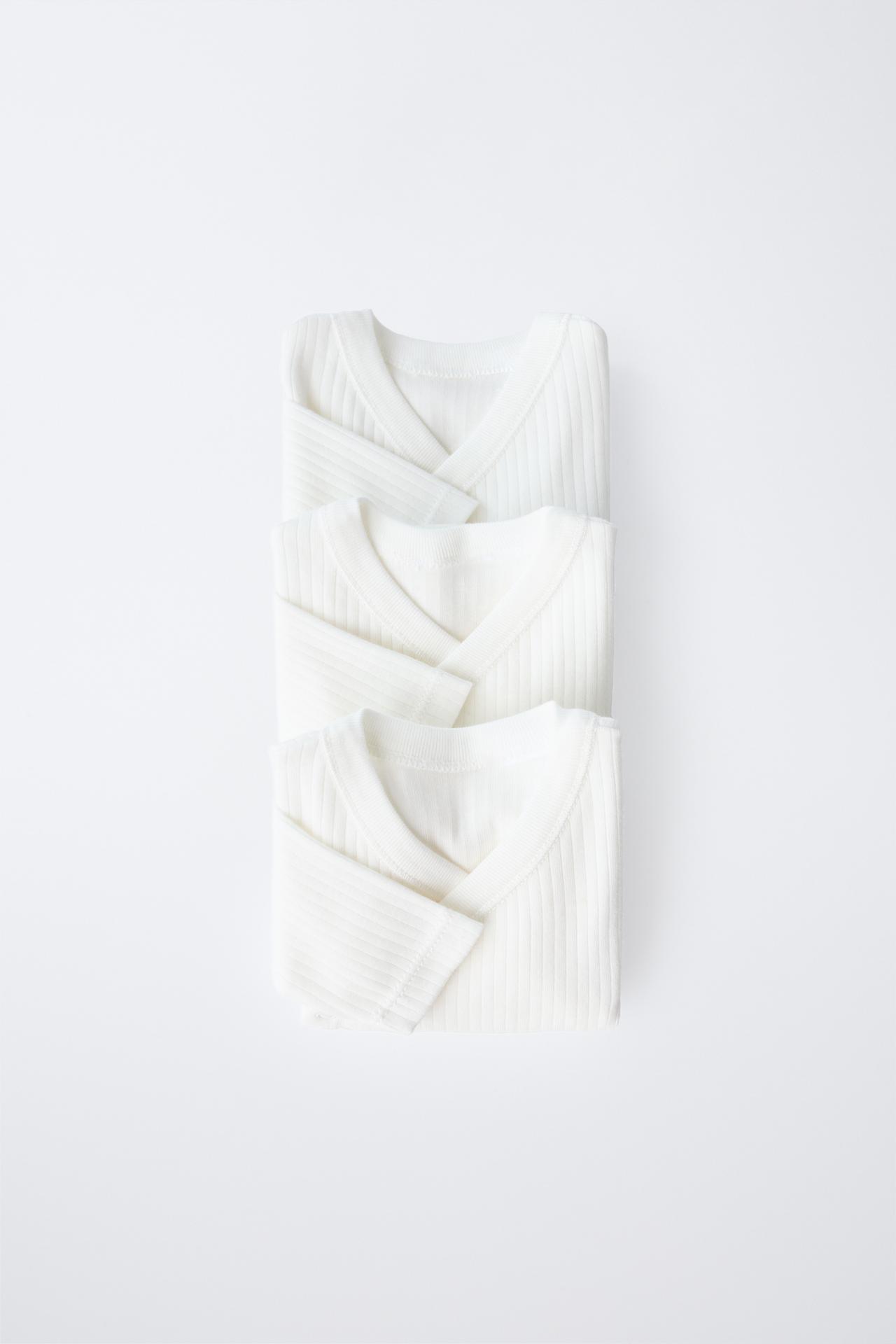 THREE-PACK OF LONG SLEEVE WRAP NECK BODYSUITS — Oyster-white