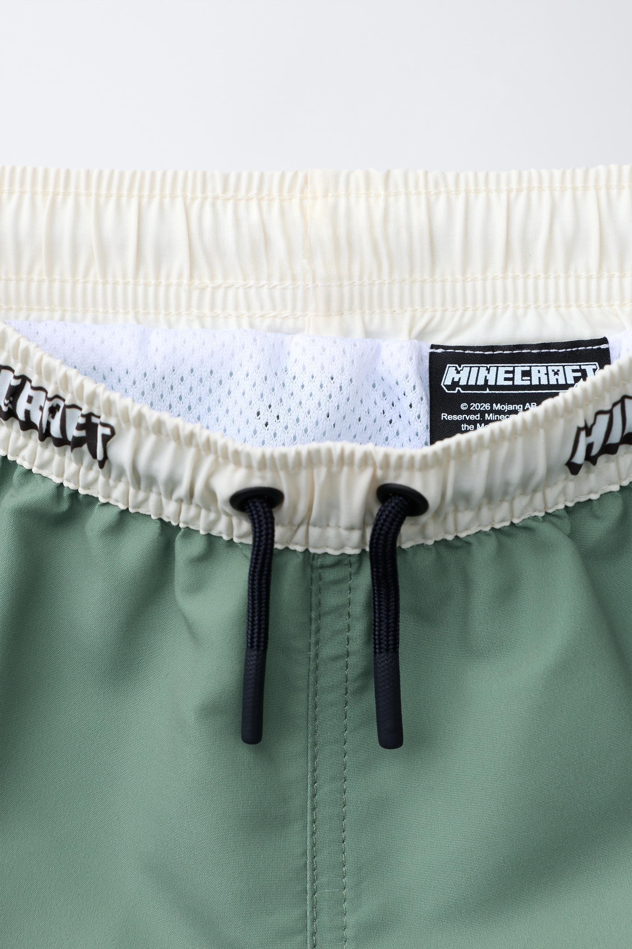 AGES 6-14 / MINECRAFT © MOJANG AB. ™ SWIM SHORTS