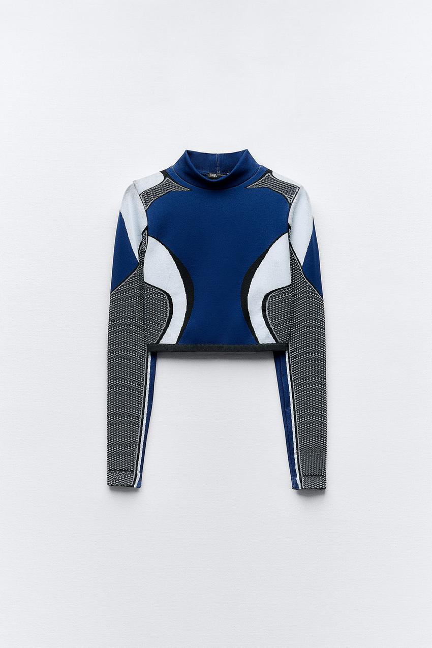 LIMITLESS CONTOUR COLLECTION<br/><br/>Fitted top with high collar and long  sleeves. - Blue / White