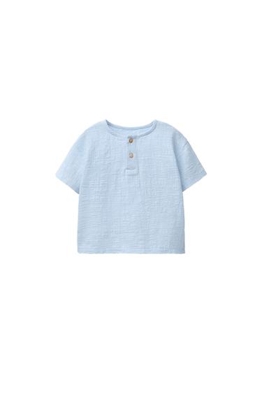 Front view of a light blue shirt with button-down collar.
