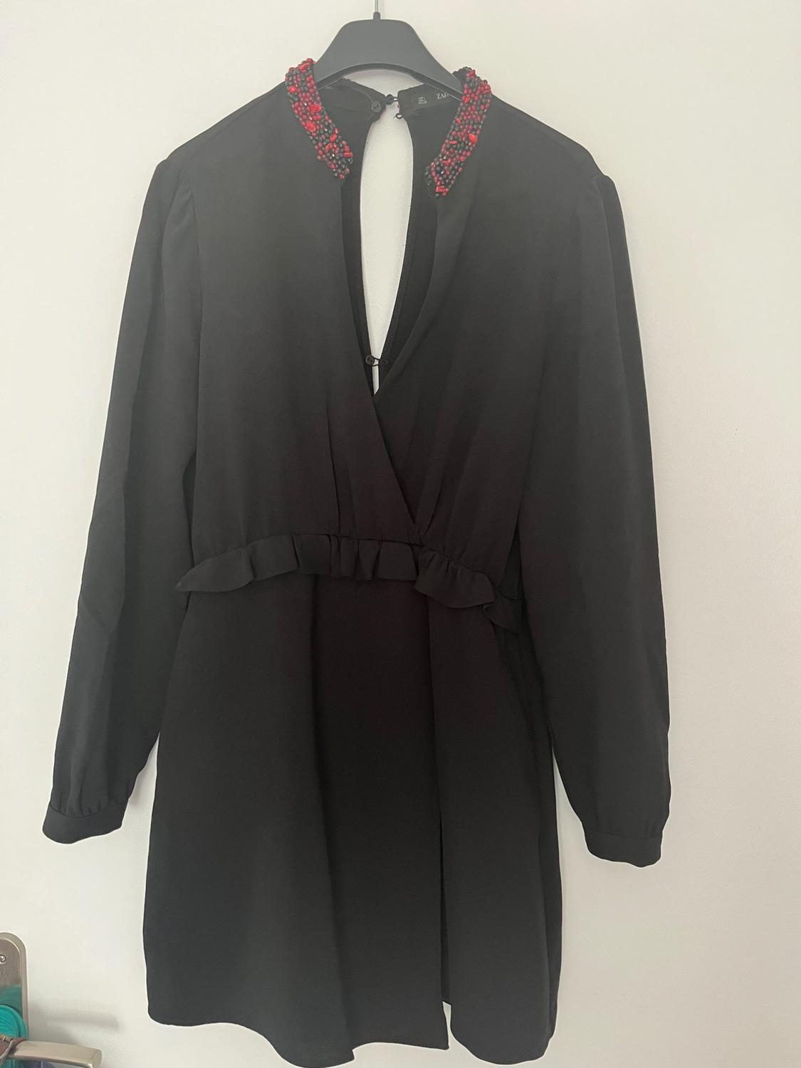 SHORT JUMPSUIT WITH BEADED COLLAR