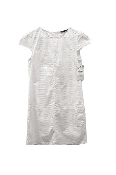 Front view of a white dress with short sleeves and a perforated design.