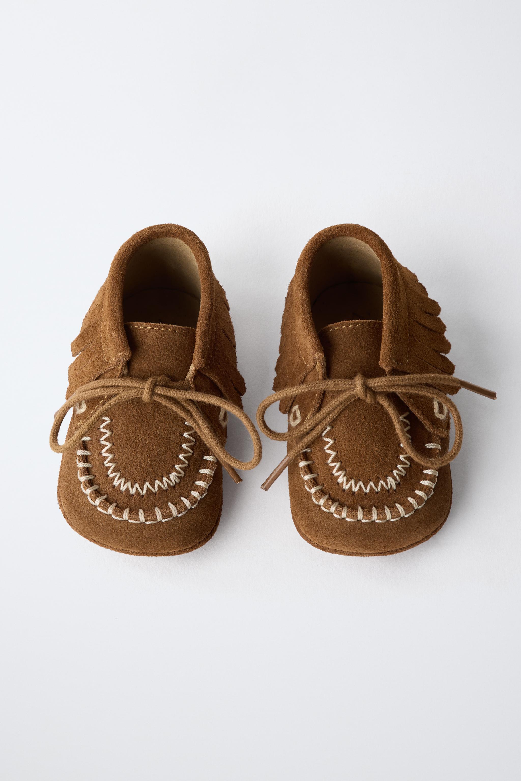BOTTINES EN CUIR À FRANGES