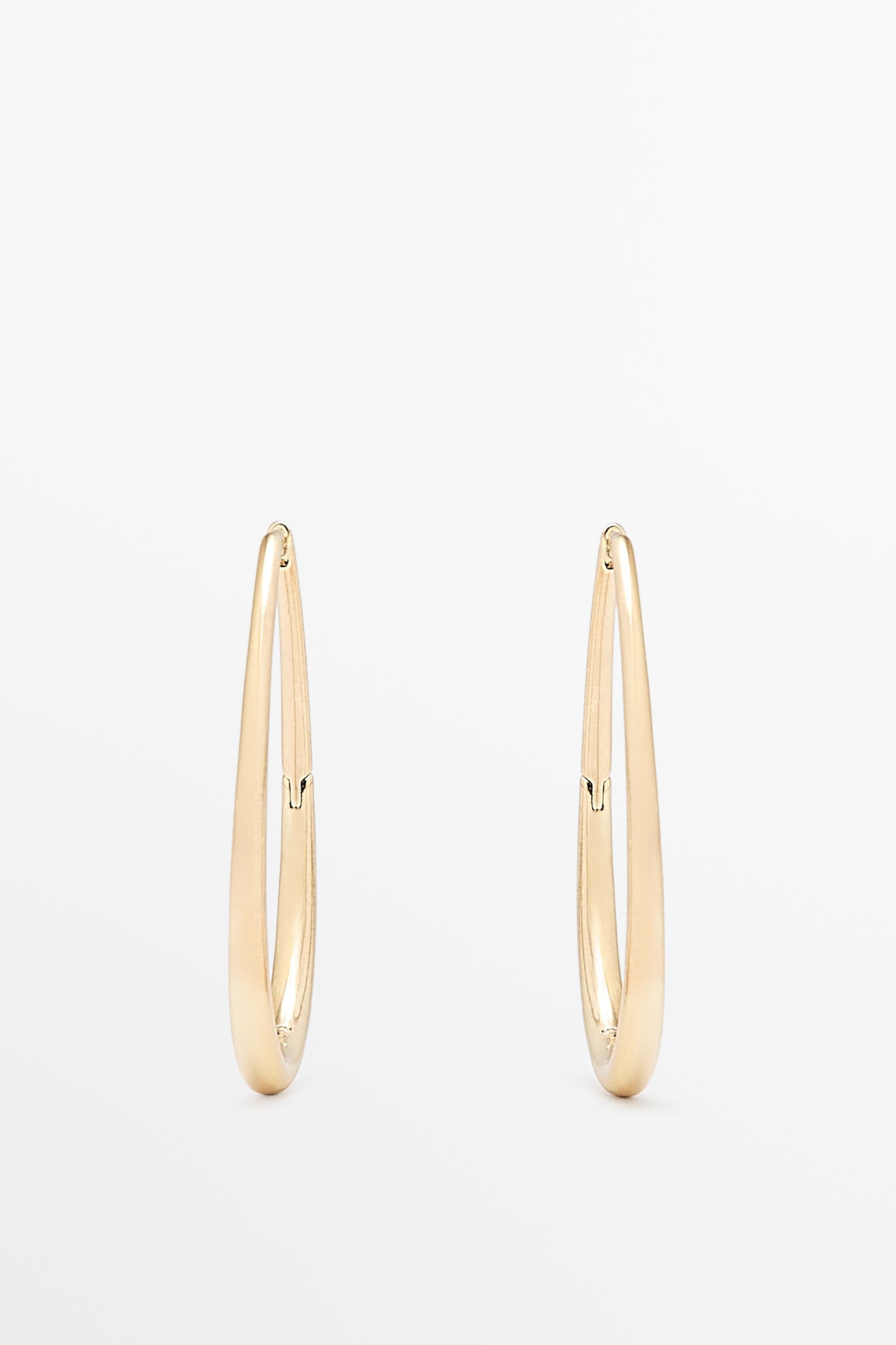 Oval hoop earrings — Golden