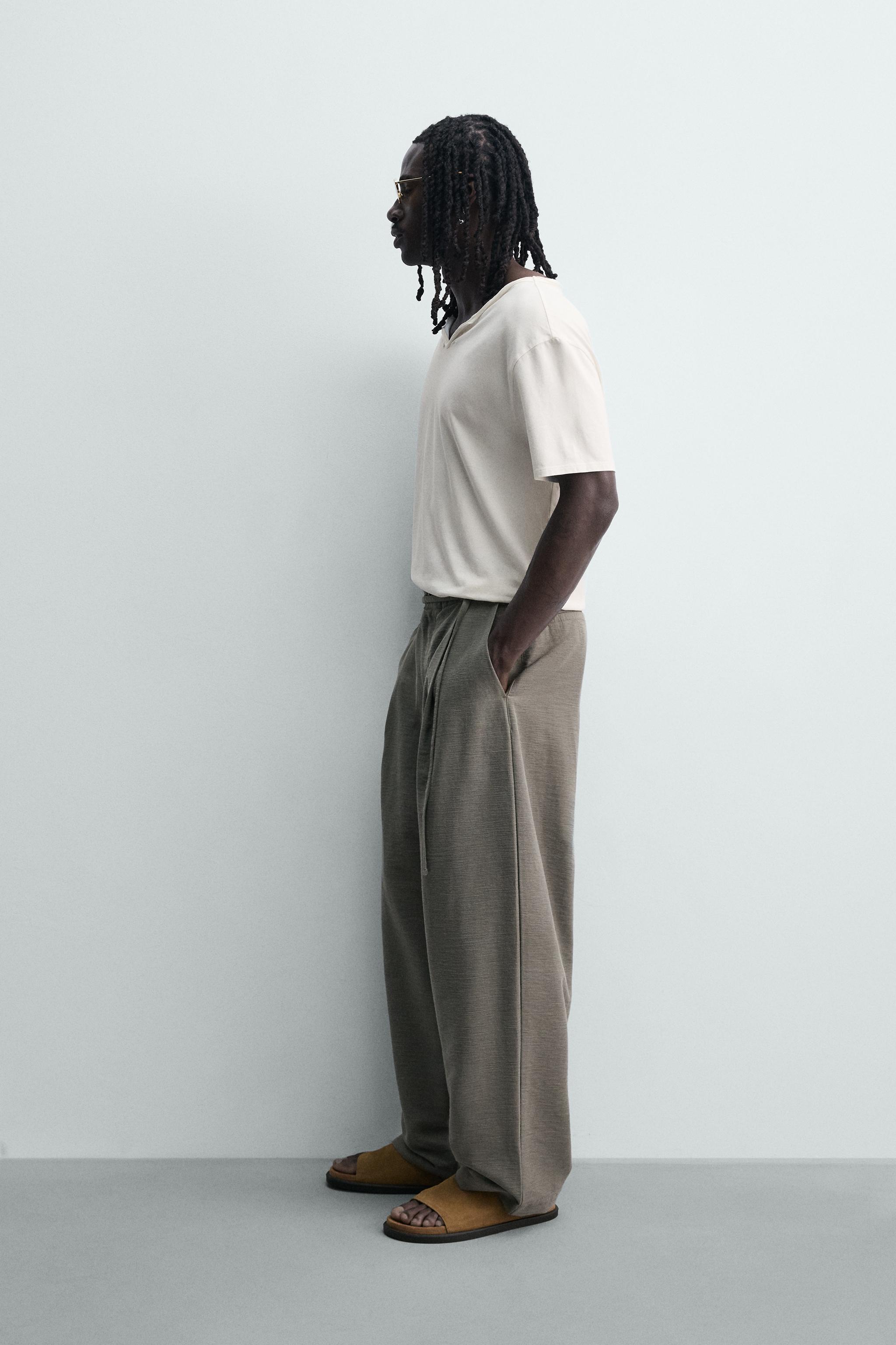 BALLOON FIT PLEATED BELTED PANTS