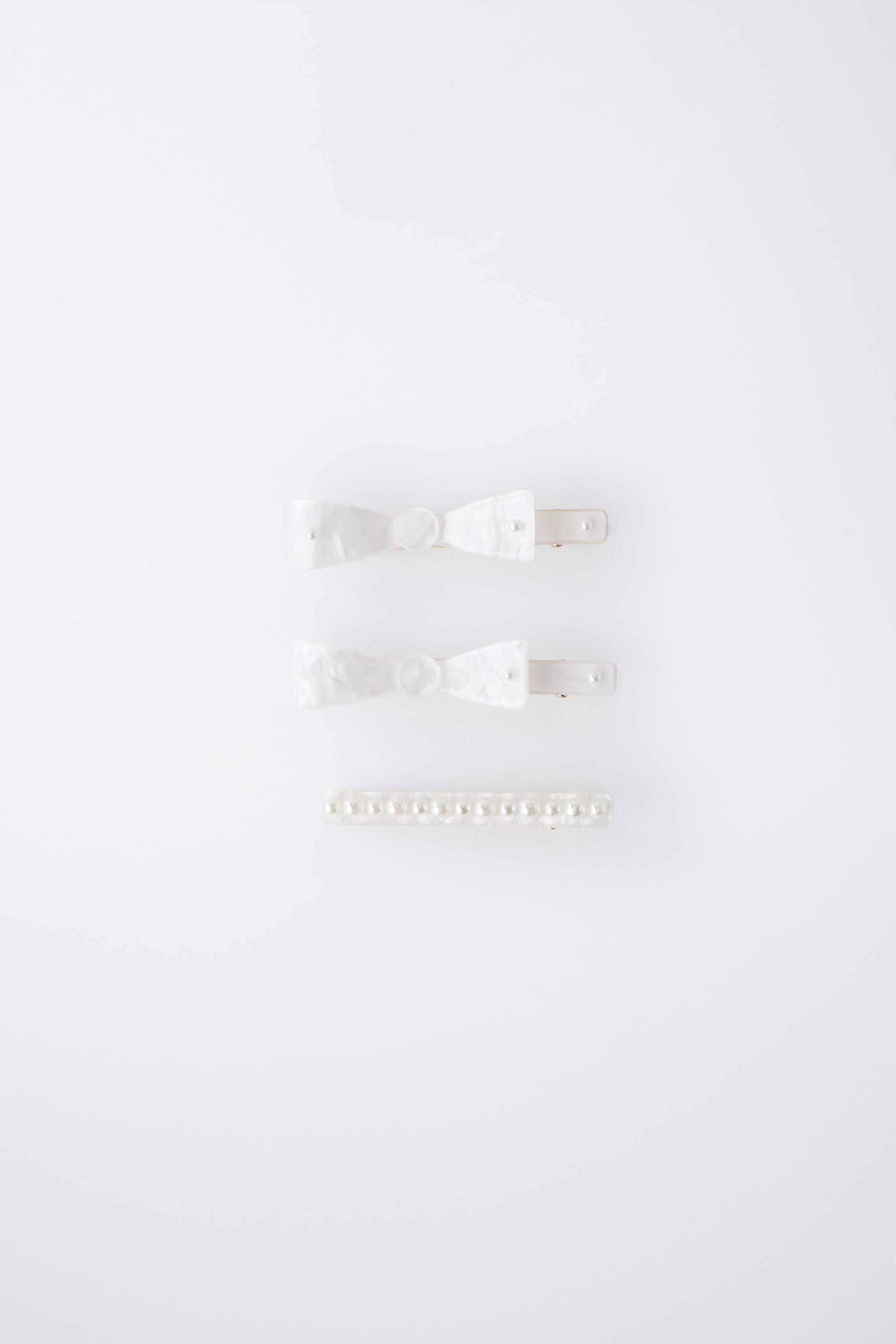 PACK OF THREE MOTHER-OF-PEARL HAIR CLIPS WITH BOWS AND PEARLS