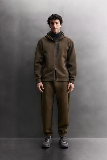 TECHNICAL TROUSERS WITH ZIPS - Brown by Zara - Image 0