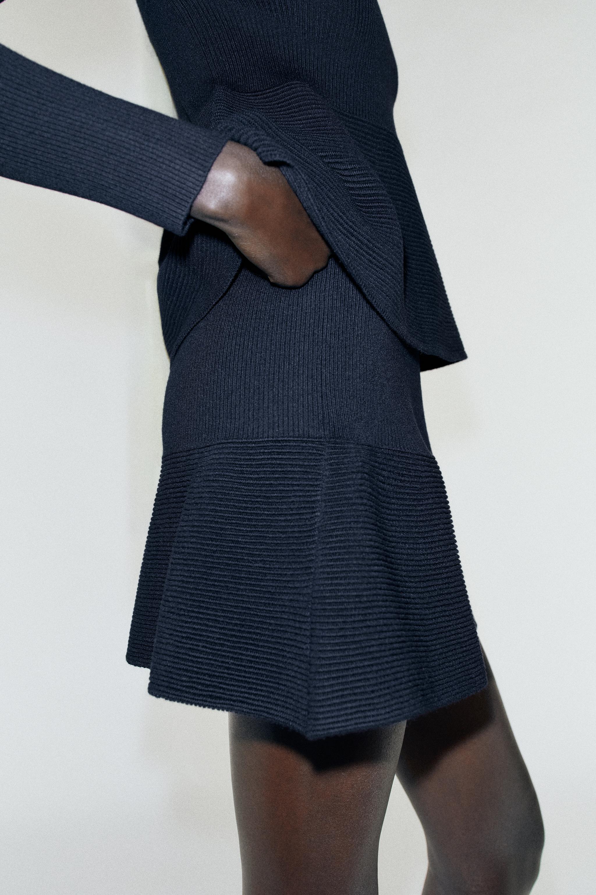 PEPLUM KNIT MINI SKIRT