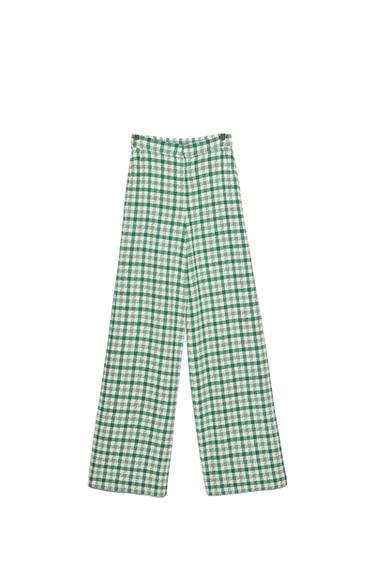 Wide-leg trousers with a green and white check pattern on a white background.