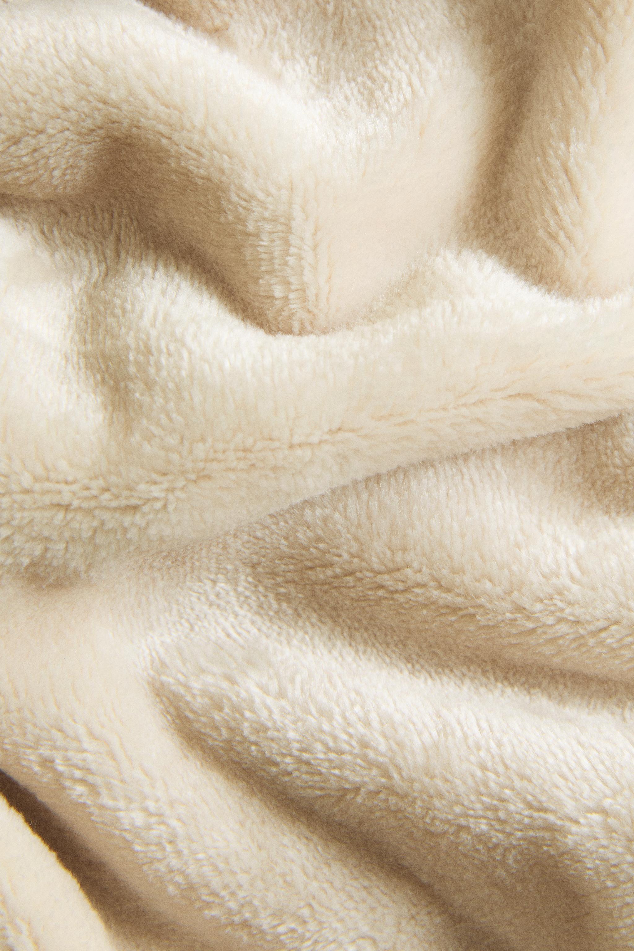 FRINGED FLEECE BLANKET