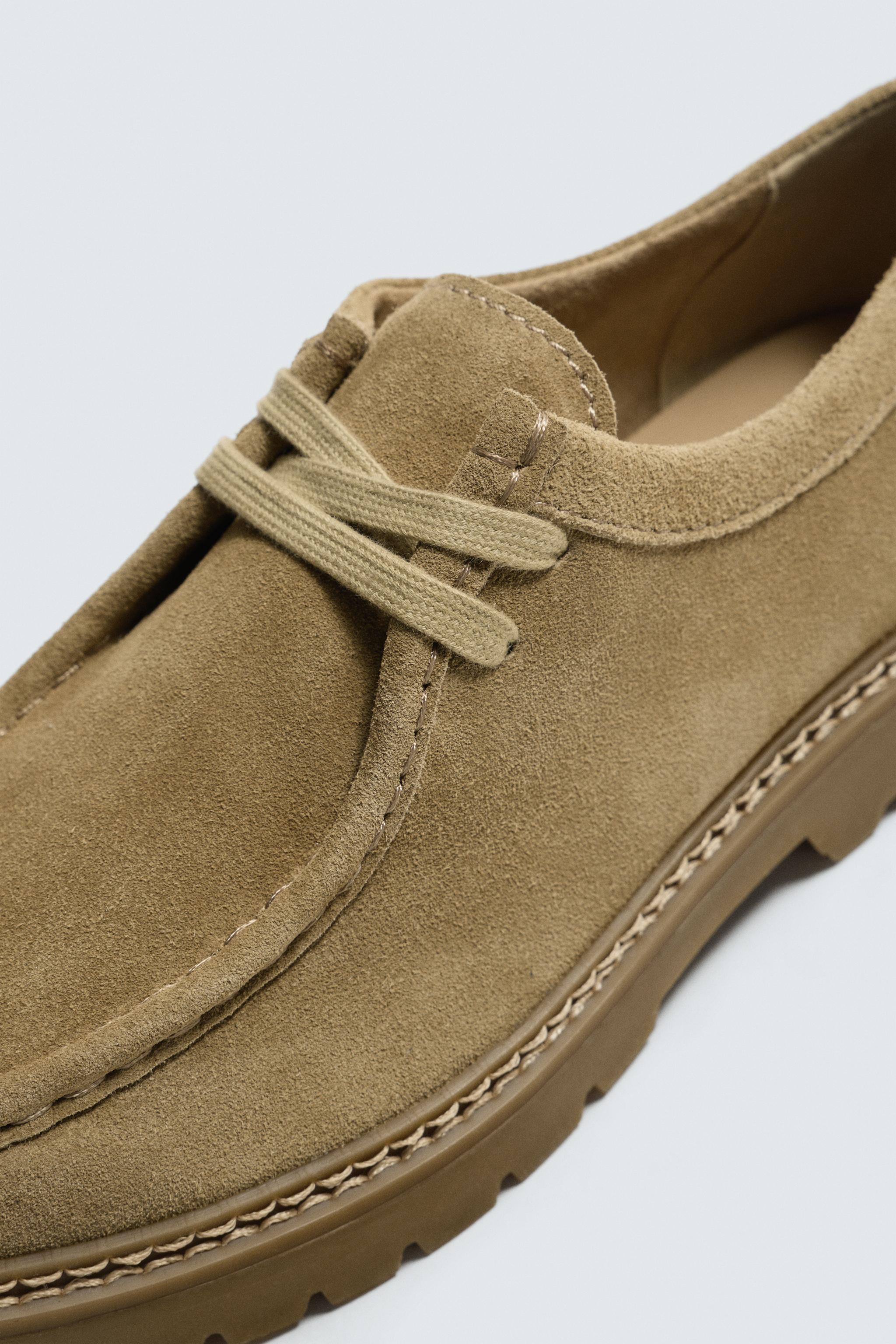 CHAUSSURES EN CUIR BORDÉES