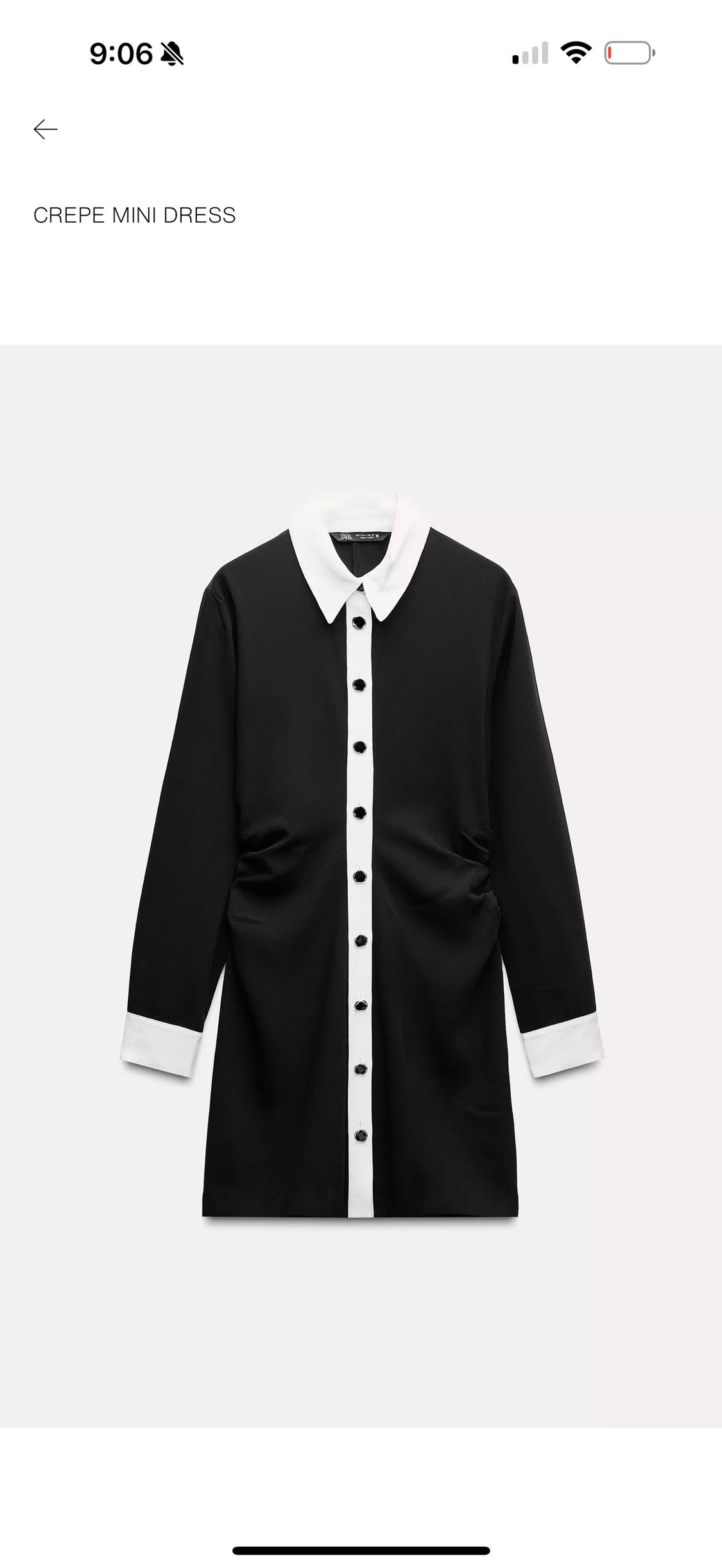 Short black dress with gathers at the waist, collar, and cuffs, and white buttons. Text: 9:06 CREPE MINI DRESS.