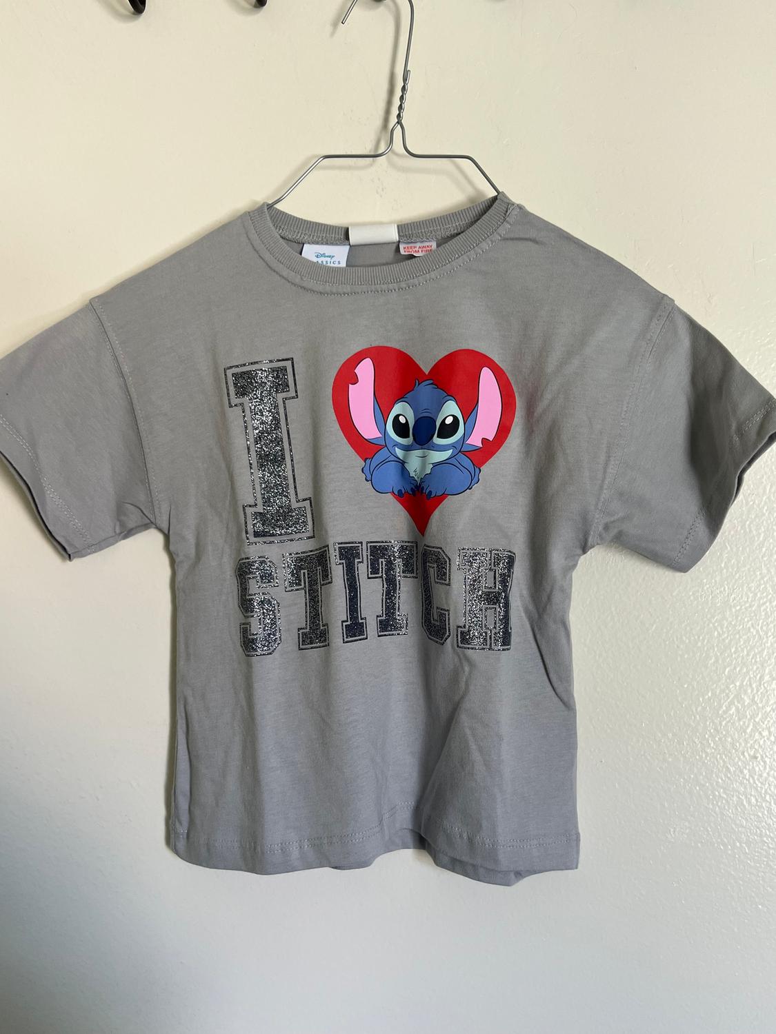 Grey hanging t-shirt with an "I ♥ Stitch" design on the front, showing Stitch inside a red heart.