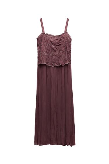 Front view of long brown dress with straps and lace on the bust.