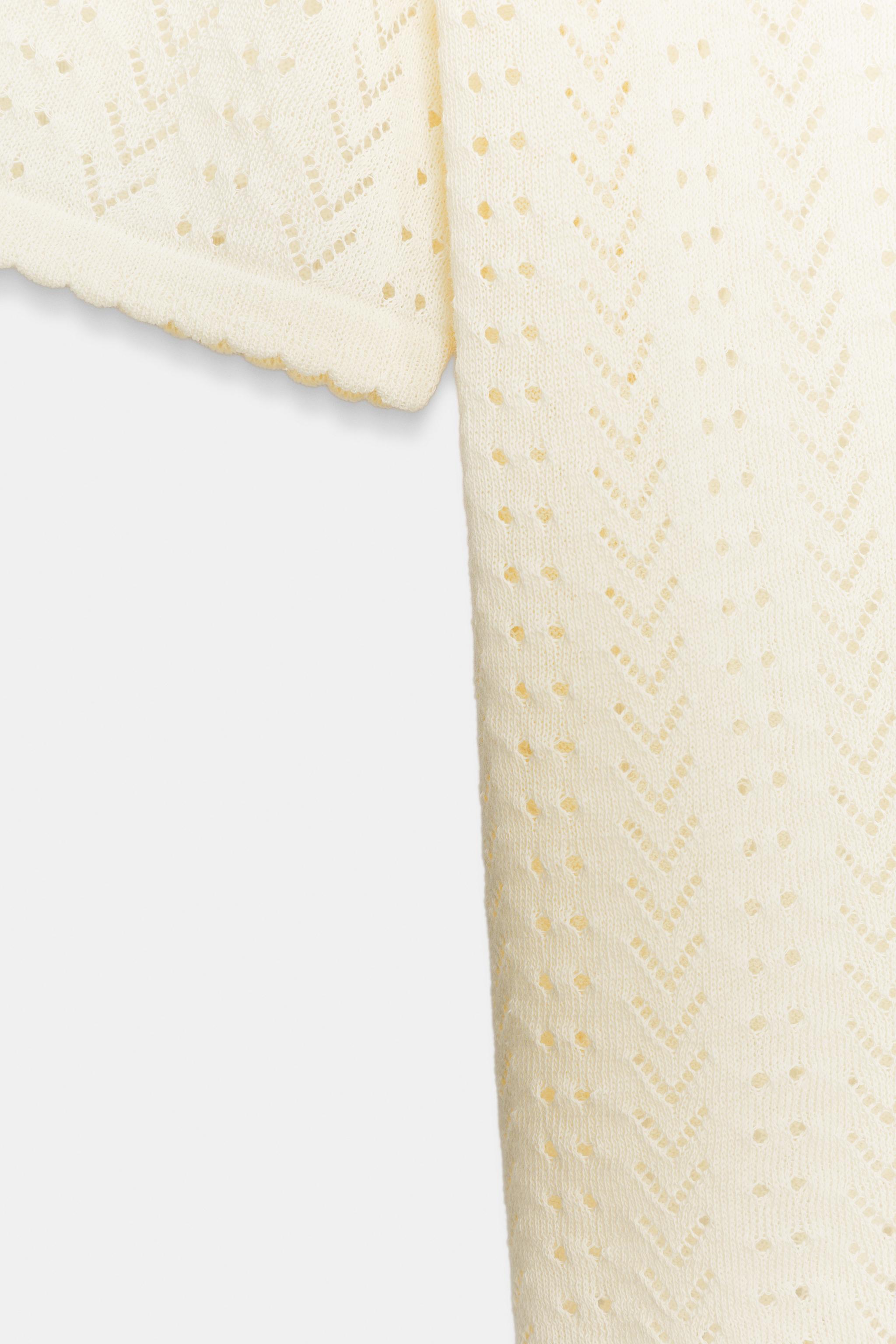 GILET EN MAILLE POINTELLE MANCHES COURTES