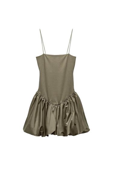 Front view of an olive green dress with thin straps and a gathered skirt.