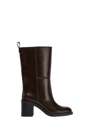 Mid-calf boot in dark brown with a block heel, visible stitching, and a rear pull tab, on a white background.