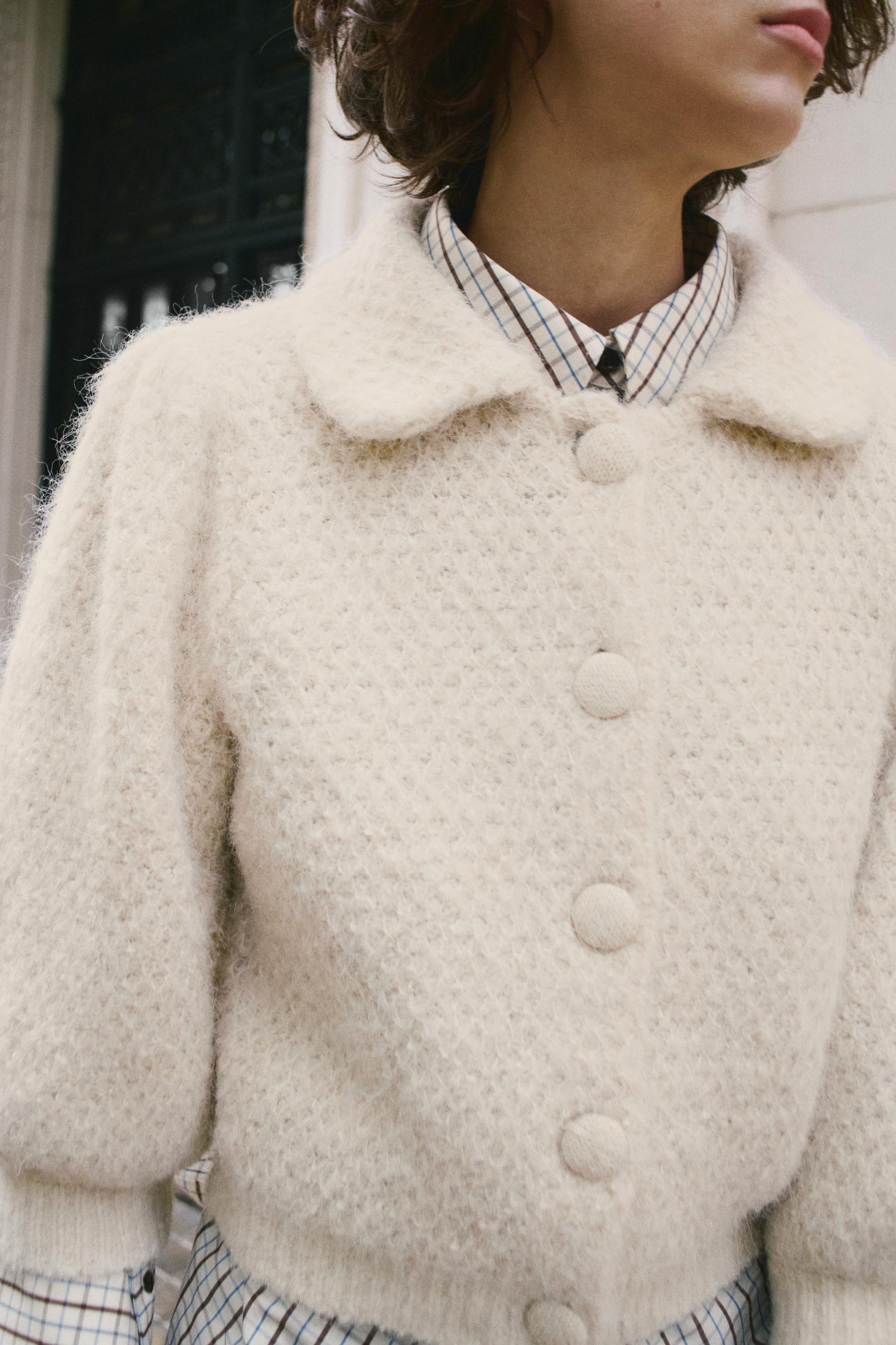 VESTE EN MAILLE À MANCHES BOUFFANTES