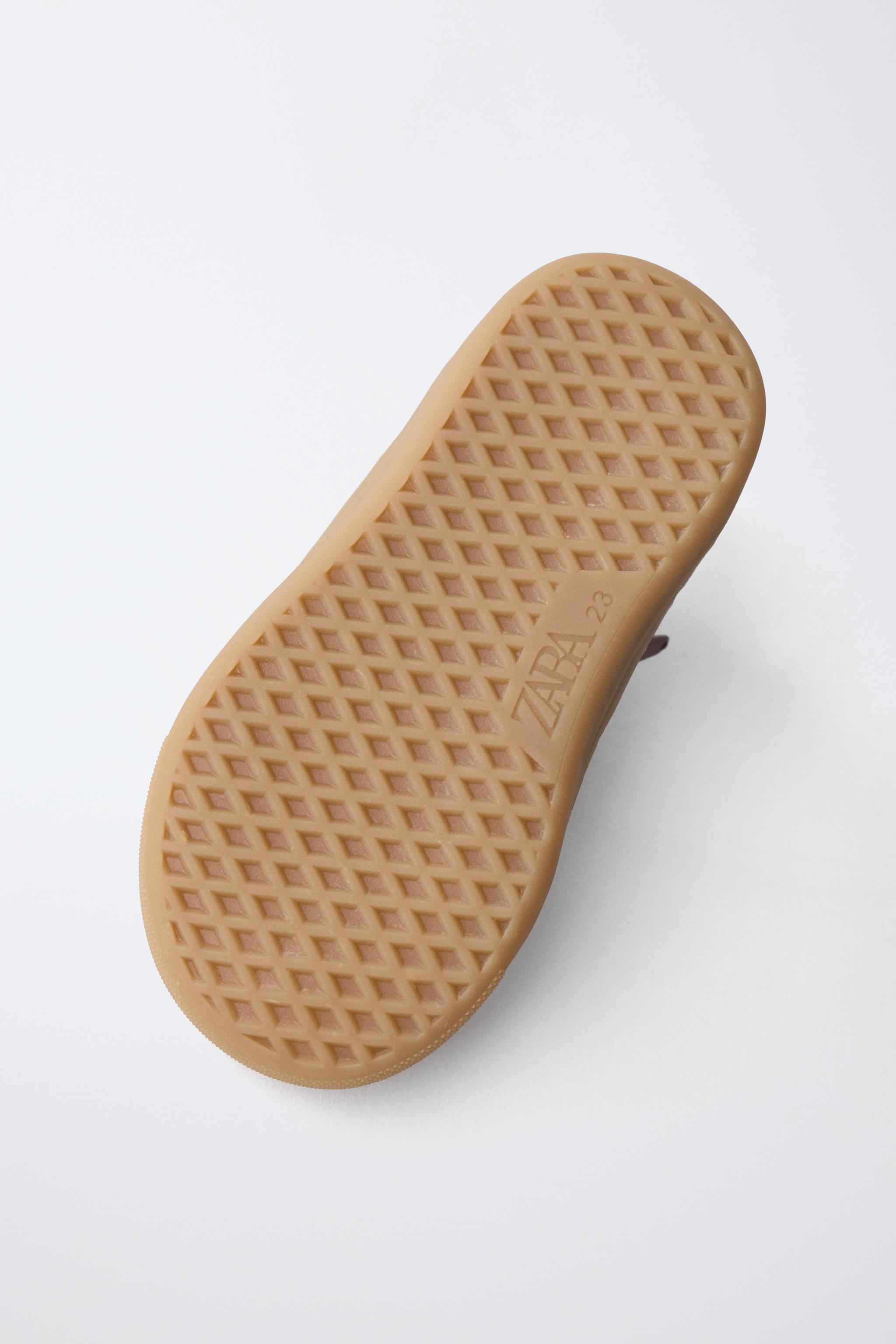 BASKETS MONTANTES EN CUIR