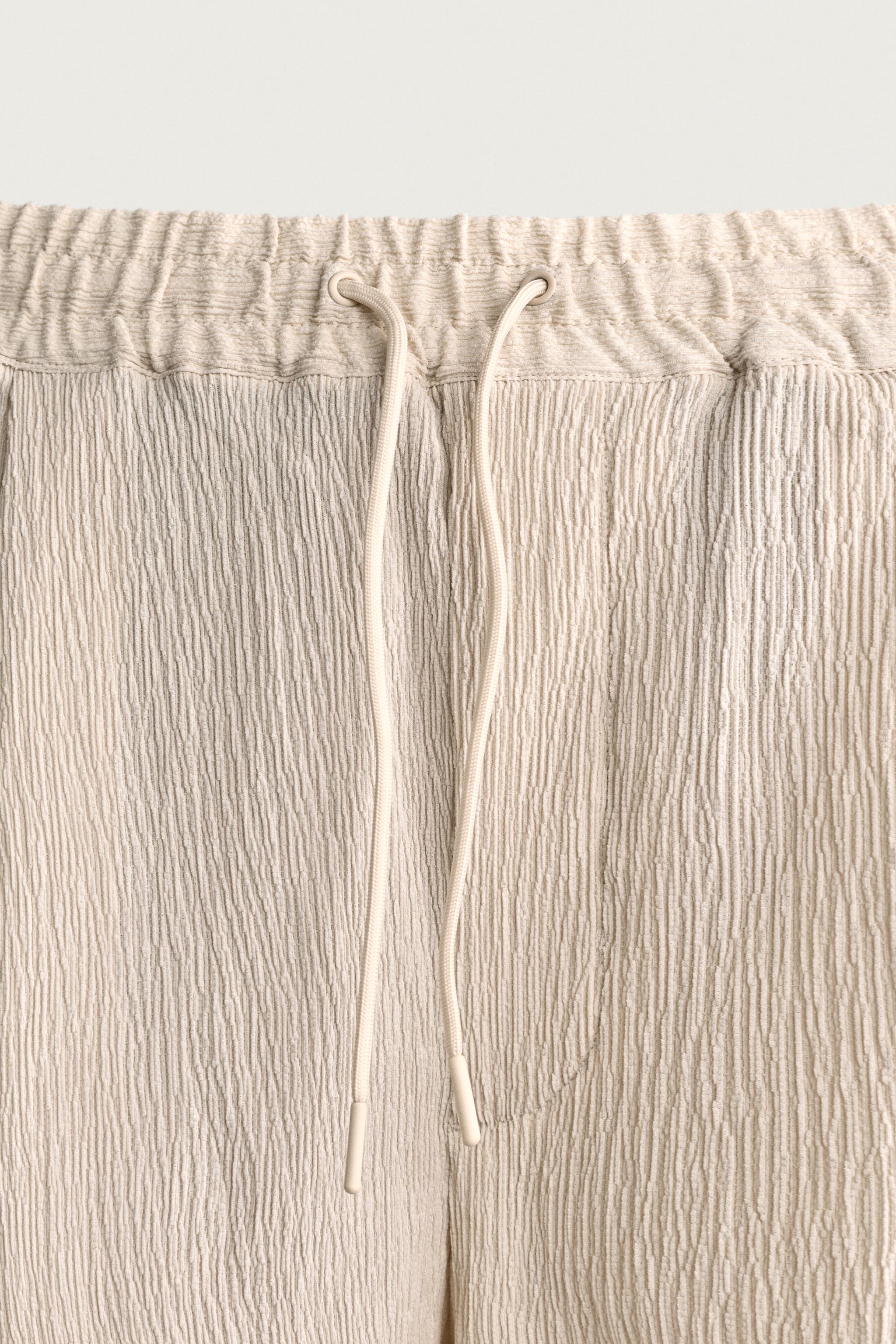 BERMUDA RELAXED FIT À RELIEF