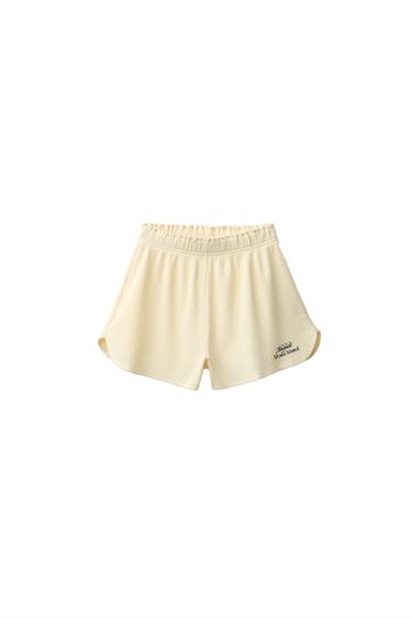 Zaras VÅFFLADE SHORTS MED TEXT - Gul
