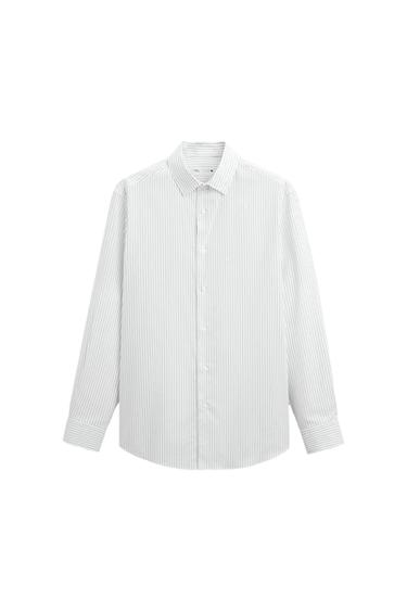 White shirt with thin vertical stripes, long sleeves and front buttons. White background. Visible inner label.