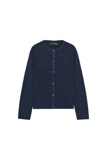 Front view of a navy blue knitted jacket with a round neck, long sleeves, and a button-front fastening.
