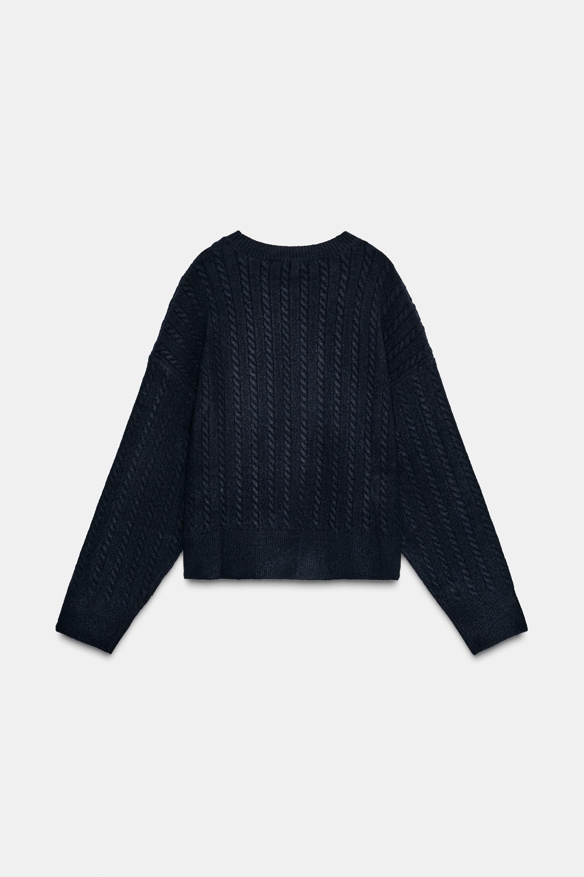 PULL EN MAILLE À TORSADES