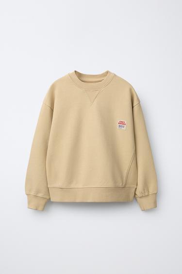 سويت شيرت بصبغة الغارمنت ببطاقة - بيج الخاص بـ Zara