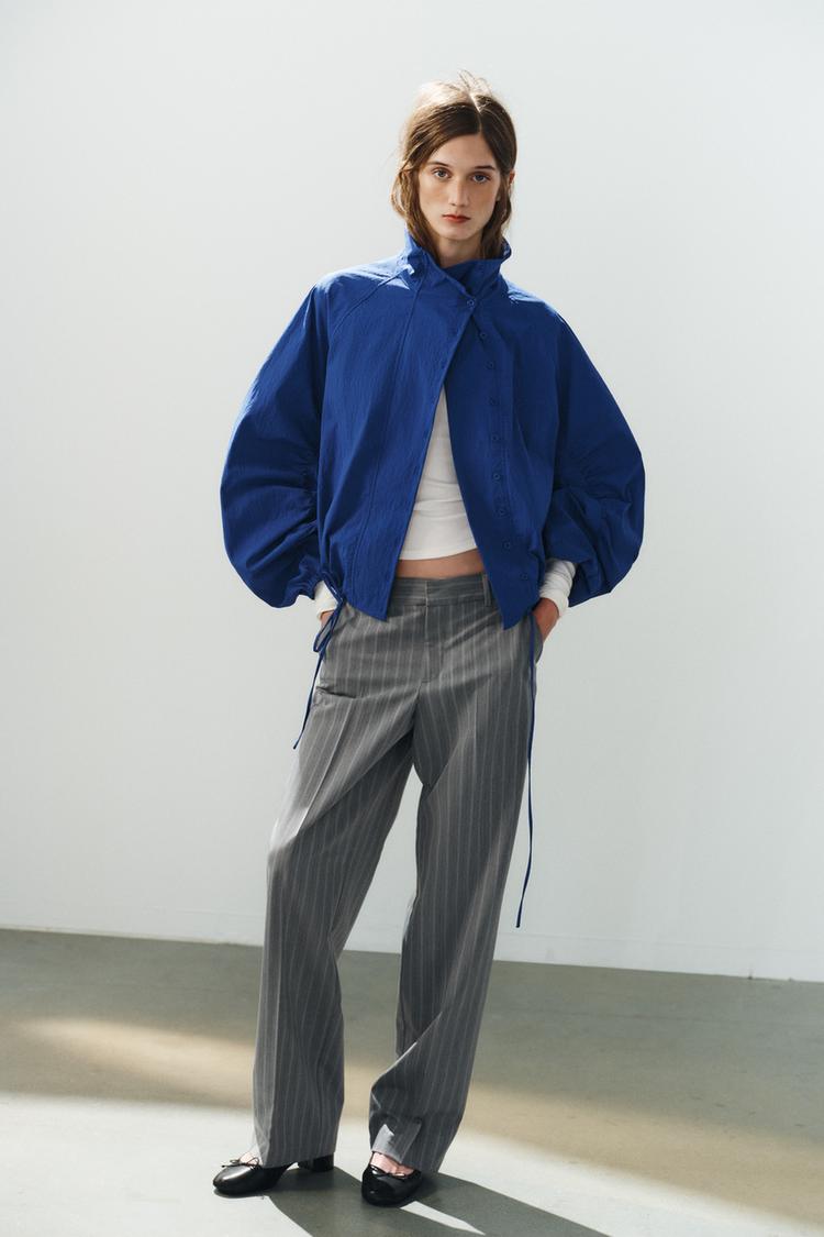 Chaqueta de tela técnica con botones 8