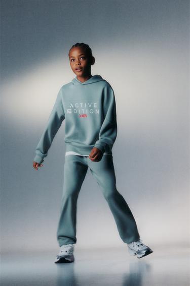 SPORTY JOGGERS WITH RUBBERISED LABEL - Blue / Grey by Zara